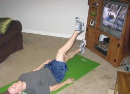 Person Doing Scissors Exercise on a Yoga Mat