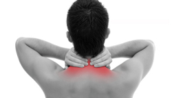 Man experiencing neck pain, needing chiropractic care in Pikesville, MD