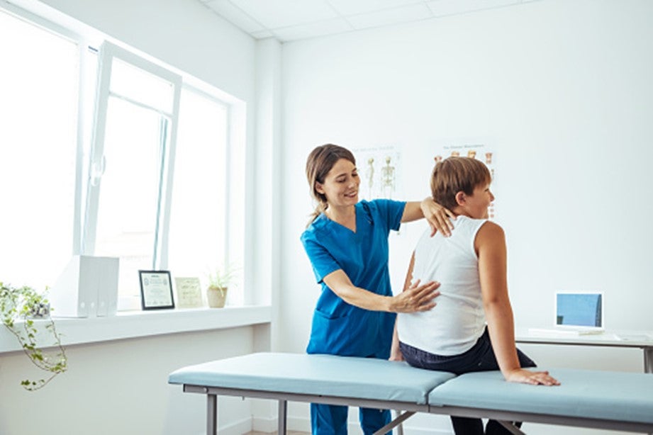 A women is getting a disc therapy from a professional in Pikesville, MD
